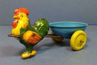 Vintage Wyandotte Lithod Tin Chicken W.  Egg Cart Pull Toy Easter Candy Container