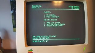 Apple IIC computer,  mouse,  monitor,  extra drive,  modem,  software & manuals 3