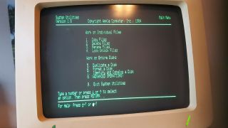 Apple IIC computer,  mouse,  monitor,  extra drive,  modem,  software & manuals 4