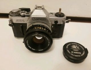 Vintage Canon Ae - 1 Camera With Fd 50mm Lens And 1984 Olympics Games Lens Cover