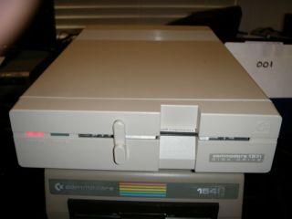 Commodore 1571 Disk Drive In Very Good With Games