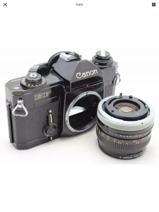 Canon EF vintage 35mm SLR camera,  lens FD 50mm 1: 1.  8 S.  C. 3