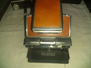 Polaroid SX - 70 Camera plus polaroid land camera 5
