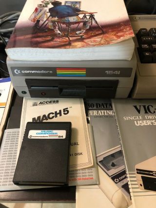 Commodore 64 computer,  1541 Disk Drive,  Music Composer,  Joystick,  Manuals,  Cords 5