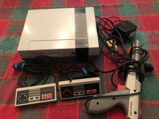 Vintage Nintendo Entertainment System.  2 Controllers,  Power Supply.
