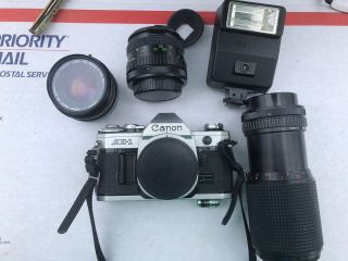 Canon Ae - 1 35 Mm Camera,  3 Lenses,  Flash And Manuals