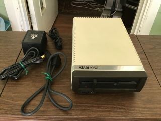 Old Atari 1050 5 1/4” Floppy Disk Drive,  Power Supply,  & Connector Cable