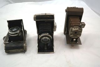 3pc Antique Folding Boxed Cameras Baldina Falcon F.  Deckel - Munchen Dolly