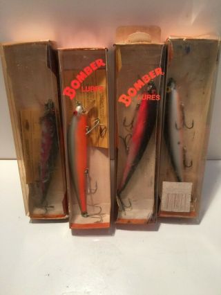 Four Vintage Bomber Long A Shallow Runner Fishing Lures With Boxes