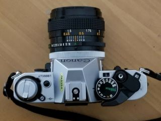 Canon AE - 1 Program 35mm SLR Film Camera w/FD 50mm Lens 1:1.  4 S.  S.  C 55mm Sky A 2