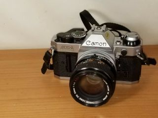 Canon AE - 1 Program 35mm SLR Film Camera w/FD 50mm Lens 1:1.  4 S.  S.  C 55mm Sky A 5