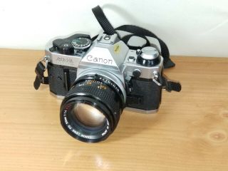 Canon AE - 1 Program 35mm SLR Film Camera w/FD 50mm Lens 1:1.  4 S.  S.  C 55mm Sky A 6