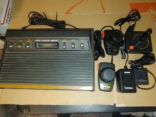 Vintage Atari 2600 Video Computer System,  Joystick,  2 Paddles,  2 Pwr Supplies