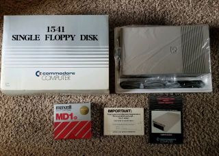 Commodore 64 Vic 1541 Floppy Disk Drive In Packaging W/ Misc.  Floppy Disks