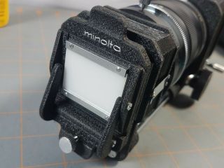 Bundle of Minolta Camera SRT101 and 5 Lenses Filters Flash Light and Case 7