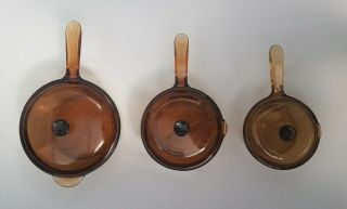 Set Of 3 Vintage Corning Amber Brown Glass Lidded Saucepans 28cm,  20cm & 16cm