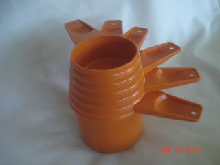 Vtg.  Tupperware 6 Pc.  Orange Nesting Measuring Cup Set Made In U.  S.  A.
