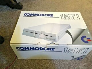 COMMODORE 1571 DISK DRIVE COMPLETE WITH USER GUIDE FOR COMMODORE 128 COMPUTER 8