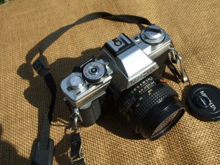 Minolta Xg - M 35mm Slr Camera With 50mm Minolta Md Lens,  With Battery Adapter