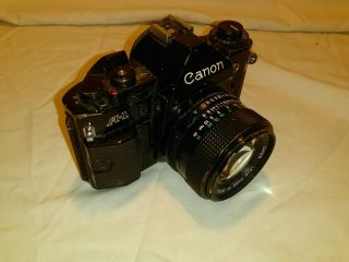 Orig vintage made in Japan Canon A - 1 SLR 35mm camera w/Canon FD 50mm f1.  4 lens 4