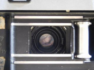 Olympus 35 - S camera w/ E.  Zuiko 1:2,  8 f=4.  8 cm lens 7