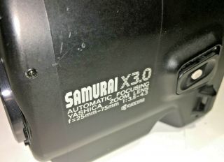 Yashica Samurai X3.  0 Half - Frame SLR for 35mm film with case,  all black,  1980s 2