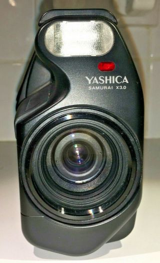 Yashica Samurai X3.  0 Half - Frame SLR for 35mm film with case,  all black,  1980s 8