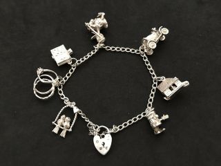Vintage Sterling Silver Charm Bracelet With 7 Silver Charms.  27 Grams