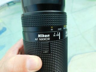 Nikon AF Nikkor 75 - 300mm lens Promaster Spectrum 7 62mm Skylight 1A 2