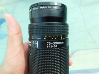 Nikon AF Nikkor 75 - 300mm lens Promaster Spectrum 7 62mm Skylight 1A 3