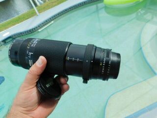 Nikon AF Nikkor 75 - 300mm lens Promaster Spectrum 7 62mm Skylight 1A 4