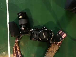 Nikon EM camera with extra lense,  flash,  strap,  and travel bag 2