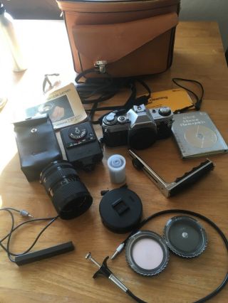 Vintage 35 Mm Canon Ae - 1 Camera With Case,  Film And Accessories.