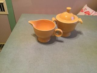 Vintage Fiesta Yellow Covered Sugar Bowl And Ring Handled Creamer