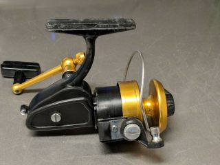 Vintage Black And Gold Penn 430ss Spinning Reel In