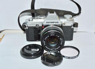 Olympus Om30 35 Mm.  Film Camera And F1.  8 50 Mm.  Zuiko Lens.