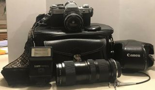 Vintage Canon Ae - 1 35mm Camera W/2 Lenses,  Flash,  Shutter Release Cable,  Strap,  Bag,