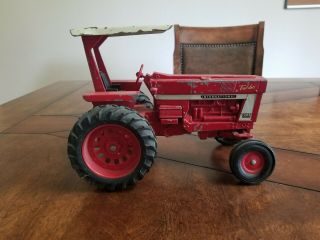 Vintage Ertl International Farmall 1066 Turbo Tractor With Factory Rops.