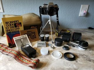 Nikon Fg 35mm Camera With 2 Lenses,  Flash,  Tripod,  Bag,  And Many.
