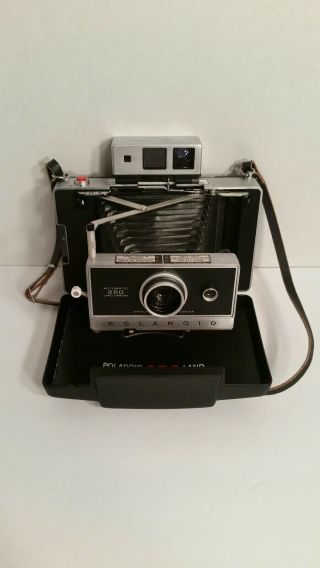 Vintage 1960’s Polaroid Automatic 250 Land Camera W/ Accessories.