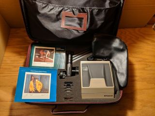Polaroid Spectra System Cameras,  Carrying Case,  Filters,  Tripod,  Manuals,  Straps