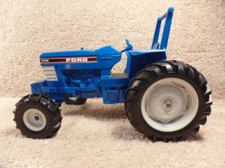 Vintage 1986 Ertl 1/16 Scale Diecast Ford 7710 Blue Farm Tractor With Rollbar
