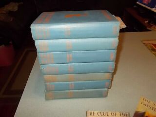 7 Vintage Nancy Drew books,  1930s editions,  blue covers w/ orange silhouette 4