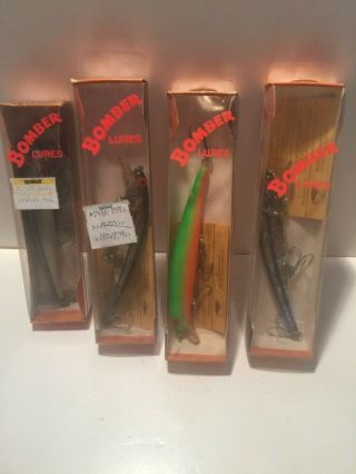 Four Vintage Bomber Long A Shallow Runner Fishing Lures In Boxes