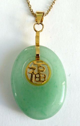 A Vintage 1980s Gold Tone Pendant Necklace With Chinese Pale Green Jade