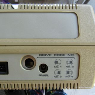 Atari 810 disk drive with some case damage - - - - 4