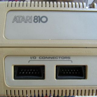 Atari 810 disk drive with some case damage - - - - 5