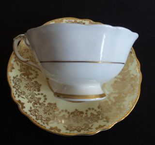 VINTAGE PARAGON TEA CUP AND SAUCER PALE YELLOW AND GOLD A1147/2 8 4