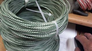100 Ft Coil Western Electric 22ga Solid Core,  Cloth Covered Tinned Pair Green
