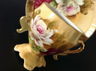 VINTAGE PEDESTAL CUP & SAUCER.  HAND PAINTED.  RED & WHITE ROSES.  GOLD ACCENTS 6